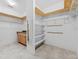 Spacious walk-in closet with custom shelving, tile floors, and lots of room for storage and organization at 13334 Palmera Vista Dr, Riverview, FL 33579