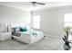 Serene bedroom with a modern bed, elegant side tables, and plenty of natural light at 13520 White Sapphire Rd, Riverview, FL 33579