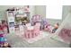 Colorful playroom with toys, a pink table and chairs, and a cozy teepee tent at 13520 White Sapphire Rd, Riverview, FL 33579