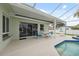Backyard featuring pool, lanai, outdoor dining and plenty of space for entertaining at 13986 Bonnie Brae Dr, Largo, FL 33774