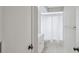 This bathroom features a single sink vanity, a shower-tub combo, and tiled floors at 13986 Bonnie Brae Dr, Largo, FL 33774