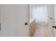 Bathroom featuring a single sink vanity, toilet and shower with a white curtain at 13986 Bonnie Brae Dr, Largo, FL 33774