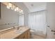 Bathroom with a single sink vanity, neutral color scheme and combined shower/tub at 13986 Bonnie Brae Dr, Largo, FL 33774