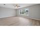 Spacious bedroom with ample natural light and a ceiling fan at 13986 Bonnie Brae Dr, Largo, FL 33774