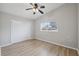 Bedroom with hardwood flooring, closet, ceiling fan and window bringing in natural light at 13986 Bonnie Brae Dr, Largo, FL 33774
