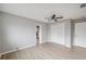 This bedroom features hardwood floors, a ceiling fan, and a closet at 13986 Bonnie Brae Dr, Largo, FL 33774