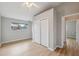 Bedroom featuring hardwood floors, closet and window offering plenty of natural light at 13986 Bonnie Brae Dr, Largo, FL 33774