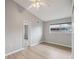 Bright bedroom with hardwood floors, ceiling fan, window and a neutral color palette at 13986 Bonnie Brae Dr, Largo, FL 33774