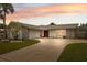 Charming single-Gathering home with stone accents, mature landscaping, and a spacious driveway at 13986 Bonnie Brae Dr, Largo, FL 33774