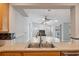 View from kitchen sink to living room featuring natural light, a fireplace, and sliding glass doors at 13986 Bonnie Brae Dr, Largo, FL 33774