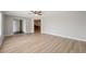 Open living space with wood floors and access to the kitchen at 13986 Bonnie Brae Dr, Largo, FL 33774