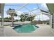 Pool and hot tub with seating in an enclosed screen creating a backyard paradise at 13986 Bonnie Brae Dr, Largo, FL 33774