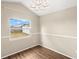 Light bedroom with a window providing natural light and backyard views at 1421 Vinetree Dr, Brandon, FL 33510