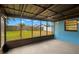 View of the screened lanai showing access to the backyard at 1421 Vinetree Dr, Brandon, FL 33510