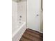 Clean, bright shower area with white fixtures and wood-look flooring at 1421 Vinetree Dr, Brandon, FL 33510