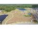 This aerial shows the community park, a lake, and walking trails in this Lithia, Florida neighborhood at 14626 Horse Trot Rd, Lithia, FL 33547