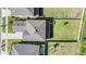 Aerial view of a home showcasing its roof, landscaping, backyard, and surrounding neighborhood at 14626 Horse Trot Rd, Lithia, FL 33547