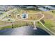 Aerial showcases the lakefront community park in Lithia, Florida, with playgrounds, trails, and sports courts at 14626 Horse Trot Rd, Lithia, FL 33547