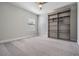 This bedroom offers carpet floors and large windows, providing natural light and comfortable atmosphere at 14626 Horse Trot Rd, Lithia, FL 33547