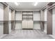 Spacious walk-in closet with custom shelving and drawers that will help you stay organized at 14626 Horse Trot Rd, Lithia, FL 33547