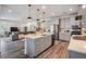 Open kitchen with center island, stainless steel appliances, and an open floorplan at 14626 Horse Trot Rd, Lithia, FL 33547