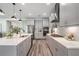 Gourmet kitchen featuring stainless steel appliances, custom cabinetry, and modern lighting at 14626 Horse Trot Rd, Lithia, FL 33547