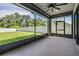 Relaxing screened patio overlooking a well-maintained backyard with green grass and privacy fence at 14626 Horse Trot Rd, Lithia, FL 33547
