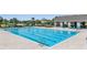 Community pool featuring crystal clear water, lounge chairs, and cabana overlooking water at 14626 Horse Trot Rd, Lithia, FL 33547