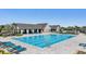 Community pool featuring crystal clear water, lounge chairs, and cabana overlooking water at 14626 Horse Trot Rd, Lithia, FL 33547