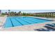 Community pool featuring crystal clear water, lounge chairs, and cabana overlooking water at 14626 Horse Trot Rd, Lithia, FL 33547