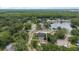 Aerial view of property at 15846 Glenarn Dr Tampa, FL 33618 surrounded by trees and nearby lake at 15846 Glenarn Dr, Tampa, FL 33618