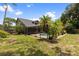 Spacious backyard featuring a screened pool and mature trees for additional privacy at 15846 Glenarn Dr, Tampa, FL 33618