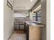 Outdoor kitchen with stainless steel appliances, a countertop, and under-counter refrigerator at 15846 Glenarn Dr, Tampa, FL 33618