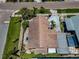An aerial view of a home featuring a well-maintained roof, landscaping, and driveway at 1801 52Nd S St, Gulfport, FL 33707