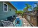 Back patio area, decorated with outdoor furniture and lush landscaping at 1801 52Nd S St, Gulfport, FL 33707