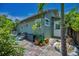 Backyard with patio area, brick pavers, lush plants and stylish outdoor decor at 1801 52Nd S St, Gulfport, FL 33707