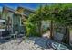 Private backyard with decorative chairs, gravel, and lush greenery at 1801 52Nd S St, Gulfport, FL 33707