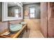 Stylish bathroom featuring vessel sinks, wood accents, and unique finishes at 1801 52Nd S St, Gulfport, FL 33707