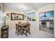 Light-filled dining area showcasing a decorative chandelier and open access to the adjacent kitchen at 1801 52Nd S St, Gulfport, FL 33707