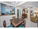 Dining area with a charming chandelier, seamlessly connecting to the kitchen and living spaces at 1801 52Nd S St, Gulfport, FL 33707