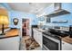 Bright kitchen with stainless steel appliances, butcher block counters, and vintage-inspired details at 1801 52Nd S St, Gulfport, FL 33707