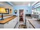 Charming kitchen featuring butcher block countertops, a farmhouse sink, and an inviting ambiance at 1801 52Nd S St, Gulfport, FL 33707