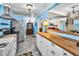 Spacious kitchen with updated appliances, butcher block countertops, and an open layout to other rooms at 1801 52Nd S St, Gulfport, FL 33707