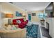 Bright living room featuring vibrant decor, stylish furniture, a decorative fireplace and plenty of natural light at 1801 52Nd S St, Gulfport, FL 33707