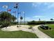 Waterfront park featuring flag poles, manicured lawn, and bay views at 1801 52Nd S St, Gulfport, FL 33707