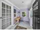 Inviting sunroom with ample natural light, showcasing a neutral palette and artistic wall decor at 1801 52Nd S St, Gulfport, FL 33707