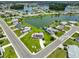 An aerial view of home featuring meticulous landscaping and convenient water access at 1811 Milford Cir, Sun City Center, FL 33573