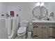 Bright bathroom featuring a walk-in tub, modern vanity, and tiled walls for accessible comfort at 1811 Milford Cir, Sun City Center, FL 33573