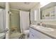 Bathroom with white vanity, enclosed shower, and neutral finishes at 1811 Milford Cir, Sun City Center, FL 33573