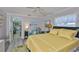 Cozy bedroom featuring a comfortable bed, ceiling fan, and relaxing decor at 1811 Milford Cir, Sun City Center, FL 33573